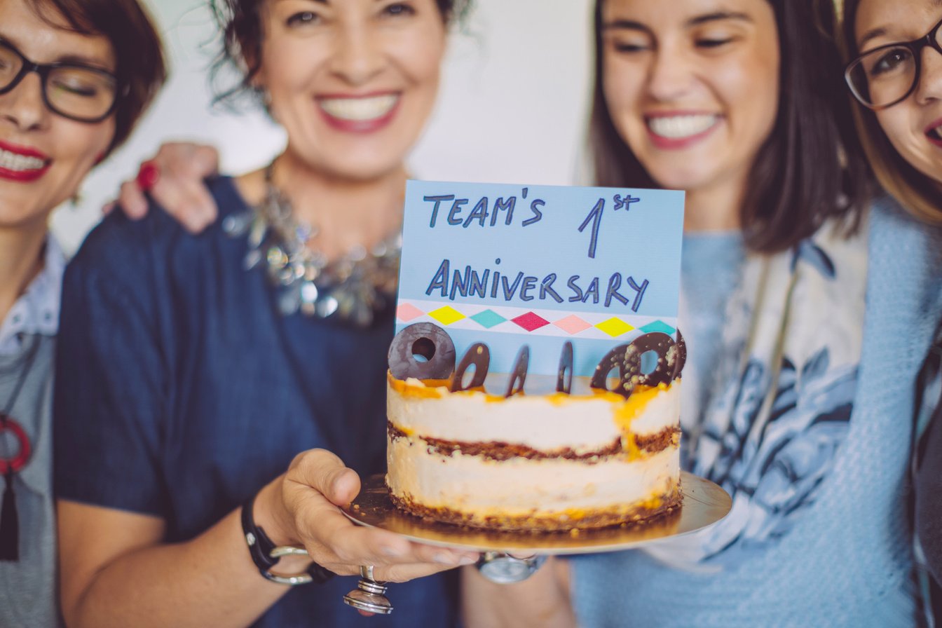 Business team celebrating the team's first anniversary